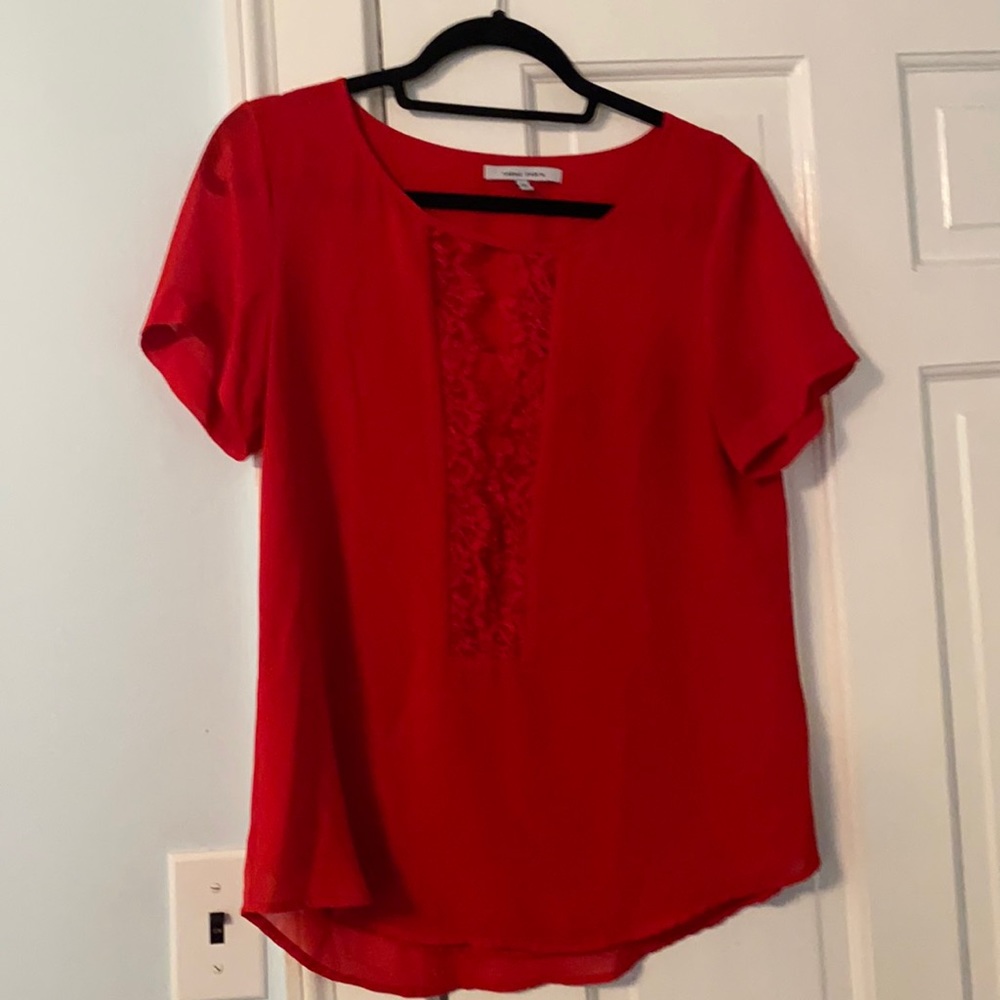 Red top with lace features and cut-out neckline